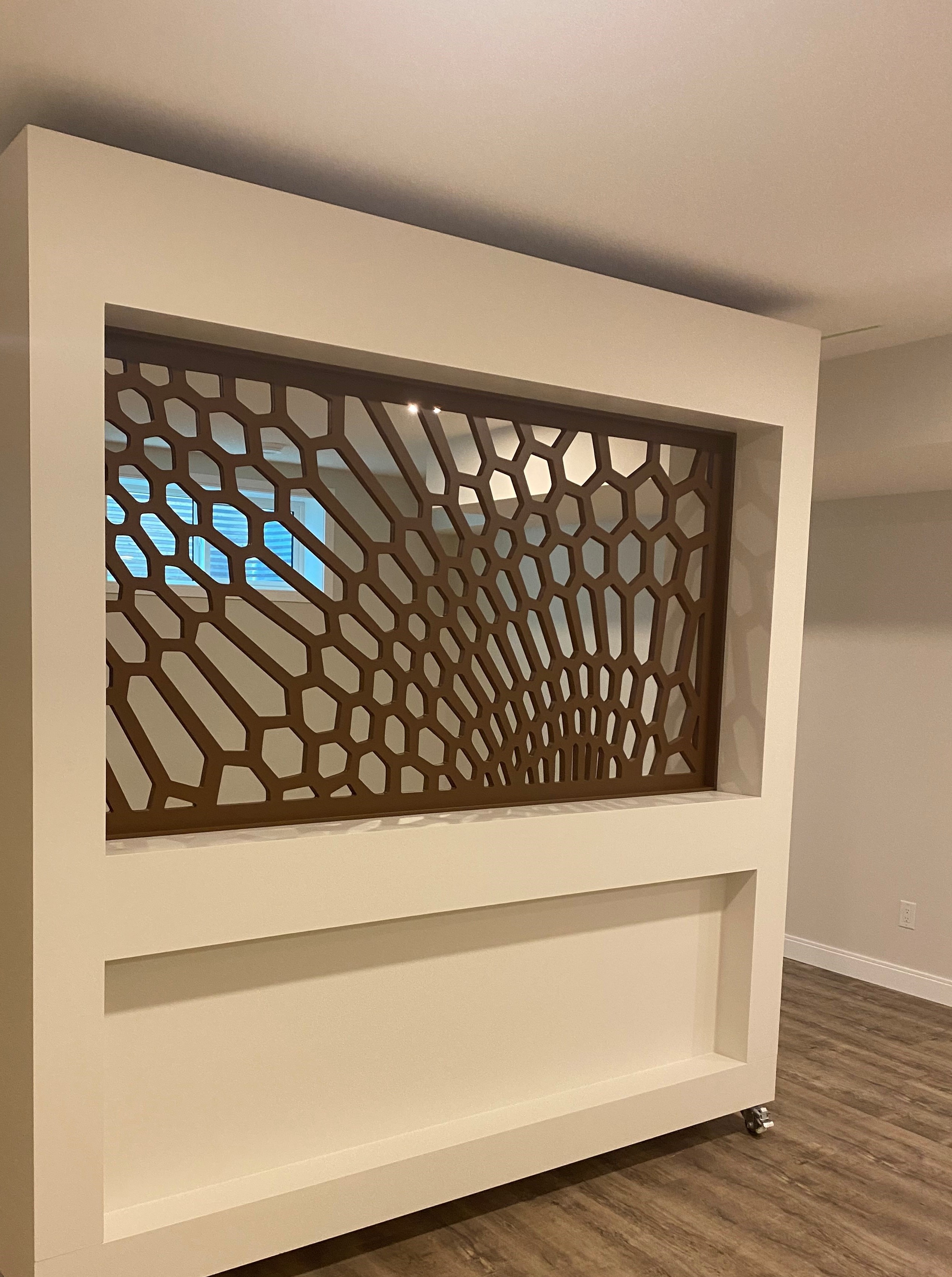 Front reception cabinetry with light wood panels