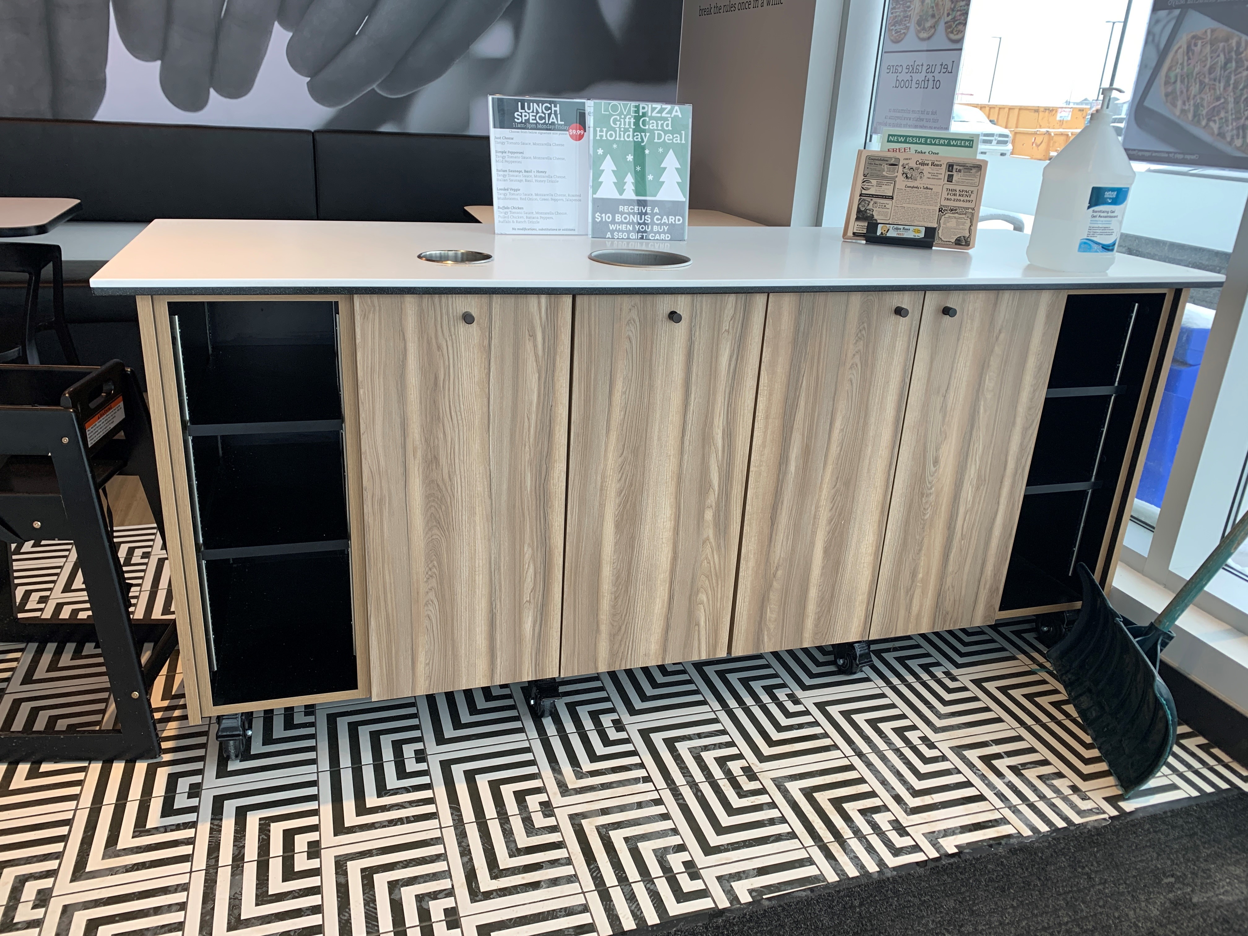 ustom commercial shelving units in a clean industrial-style room with polished concrete floor