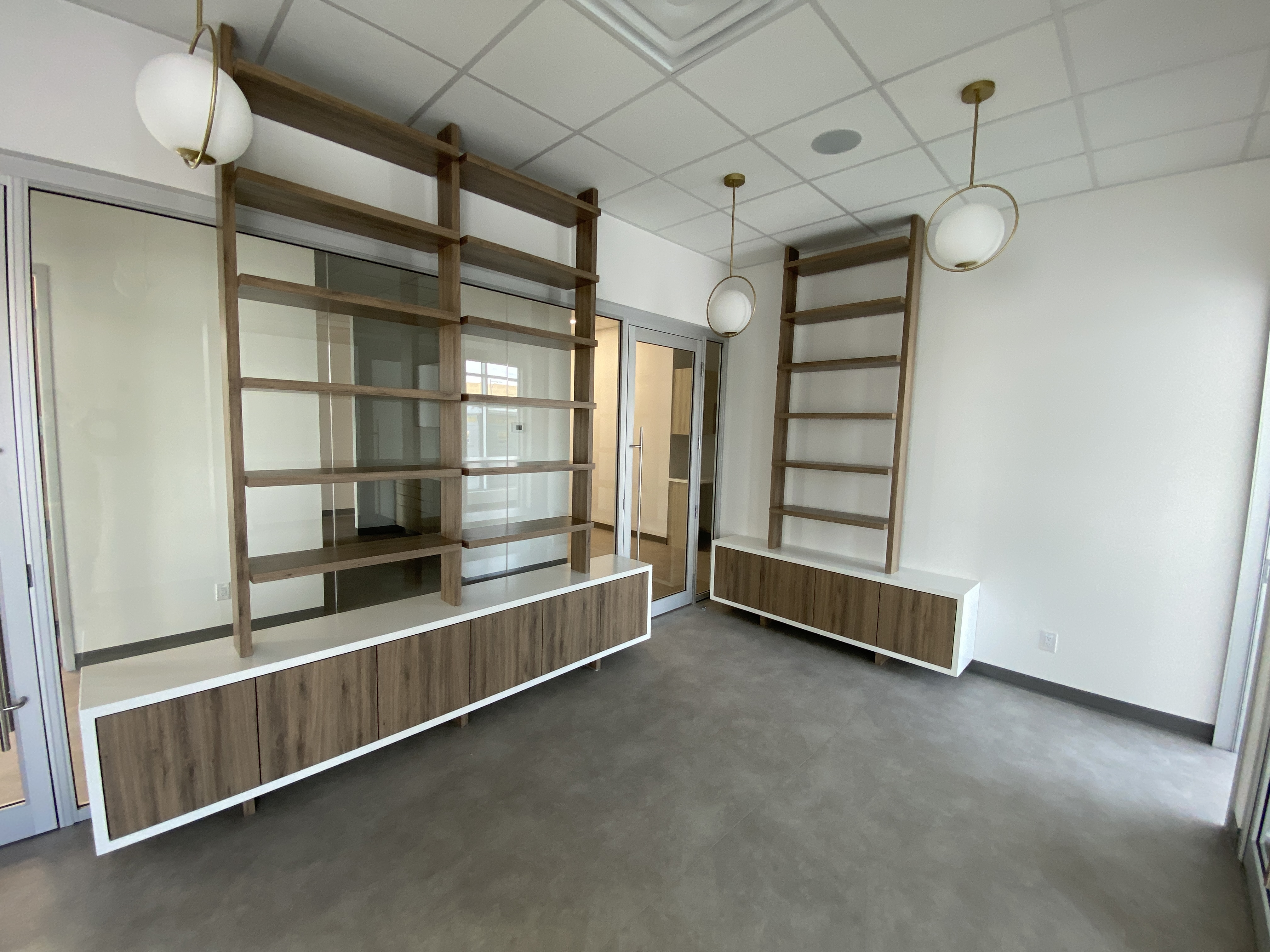 Front reception cabinetry with light wood panels